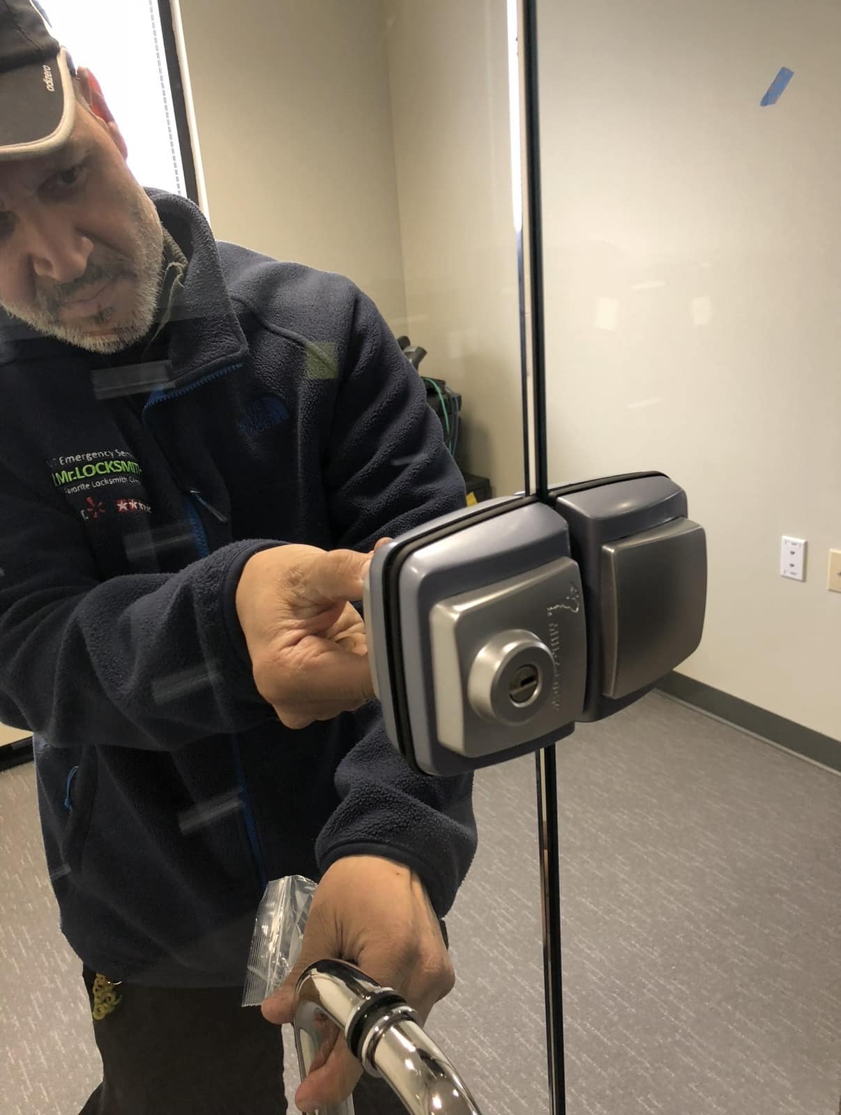 Mr. Locksmith DC technician installing high-security lock on commercial glass door in Washington DC